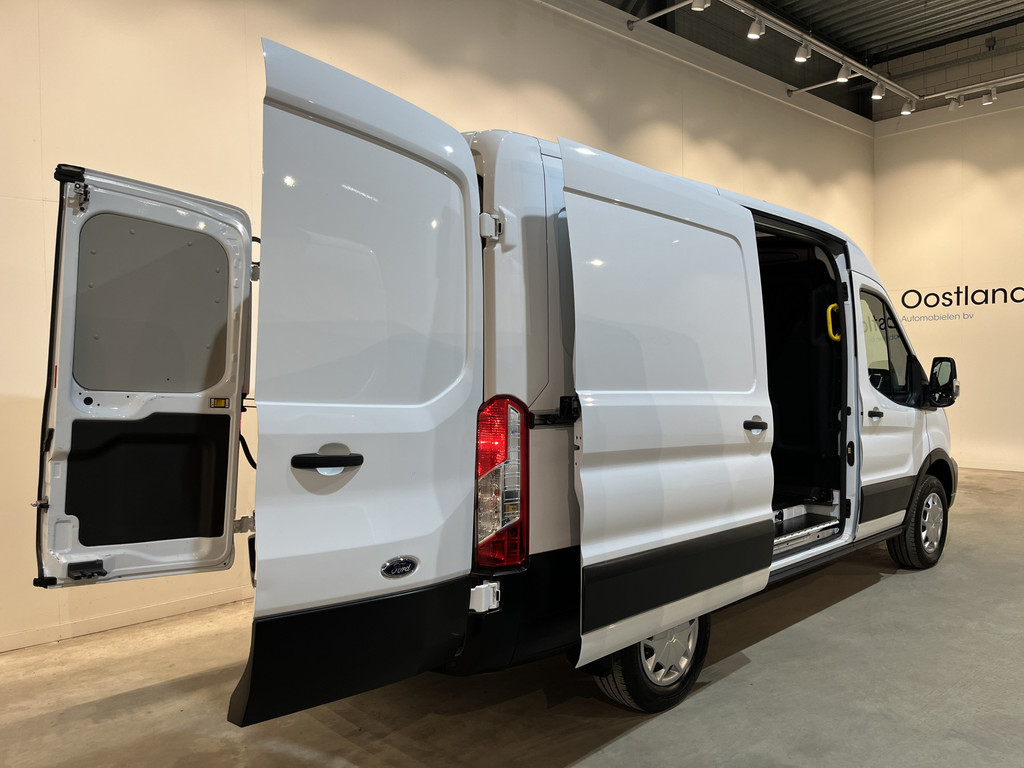 Ford E-Transit 350 L2H2 Trend 68 kWh / 100% Elektrisch !! / Airco / Cruise Control / CarPlay / Camera / Navigatie / 3-Zits / 12.200 KM !! 21