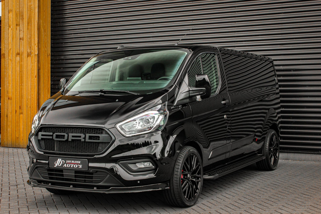 Ford Transit Custom 300 2.0 TDCI L2H1 JB-EDITION / 130PK AUTOMAAT / FULL BLACK / RAPTOR GRILL / SIDE-BARS / TREKHAAK /APPLECARPLAY 10