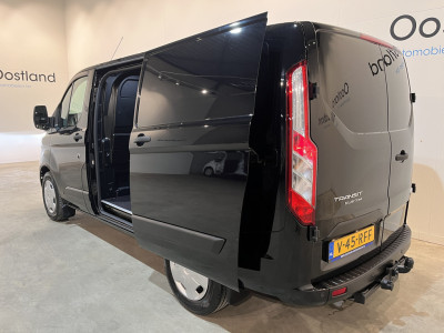 Ford Transit Custom 300 2.0 TDCI L1H1 Trend 130 PK Automaat / Euro 6 / Schuifdeur L + R / Airco / CarPlay / Cruise Control Adap. / Trekhaak / Xenon / Navigatie / 3-Zits / 27.300 KM !! foto 17